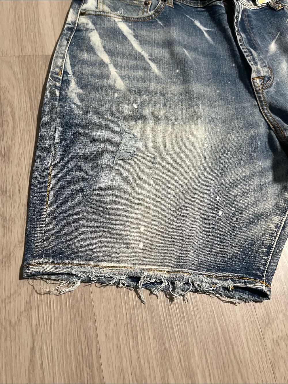 AKOO Men's Distressed Denim Shorts in Washed Blue with Paint Splatter - Picture 2 of 5